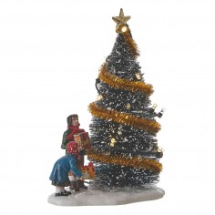Putting presents under the christmas tree battery operated -